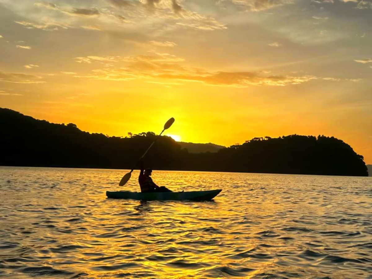 Private sunrise kayak tour at Lake Ilopango with panoramic breakfast and Historic Center visit